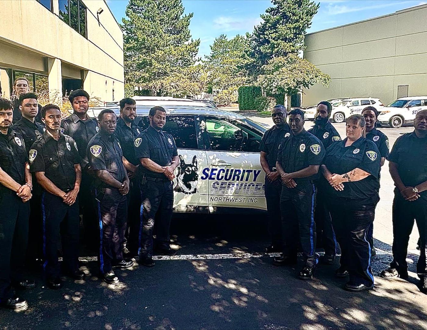 group of security officers in front of patrol vehicle