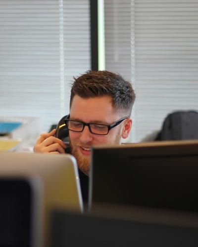 male dispatcher answering phone