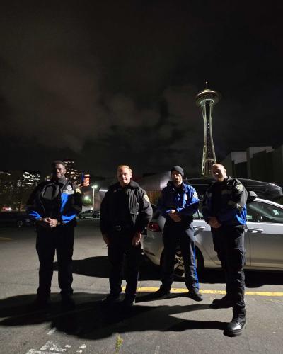 four officers in seattle with space needle in background