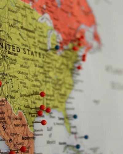 map of united states with push pins in different cities